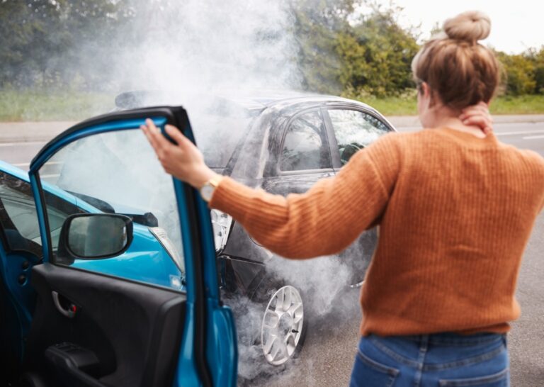 South Florida car accident scene showing vehicle damage caused by distracted or impaired driving on a busy road.