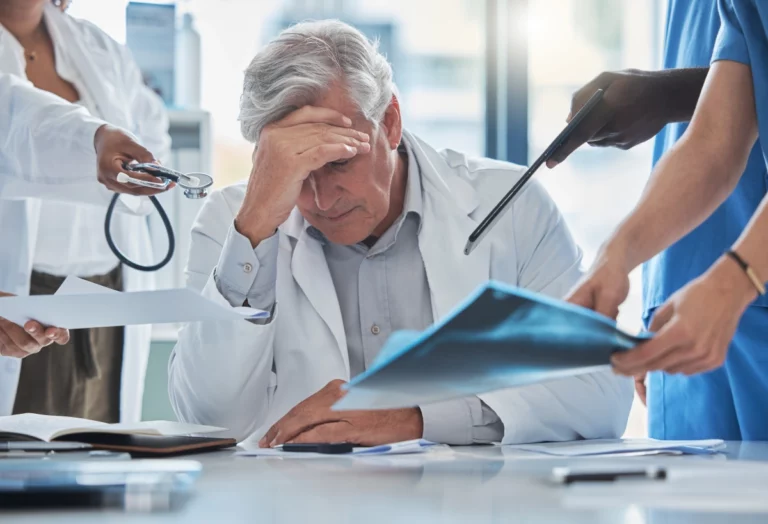 Doctor reviewing a patient chart representing the standard of care analysis in a Florida medical malpractice case.